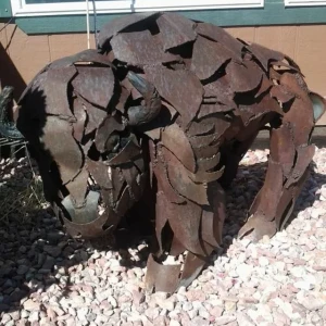 a buffalo made of pieces of overlapping metal