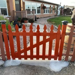 red wood picket fence gate